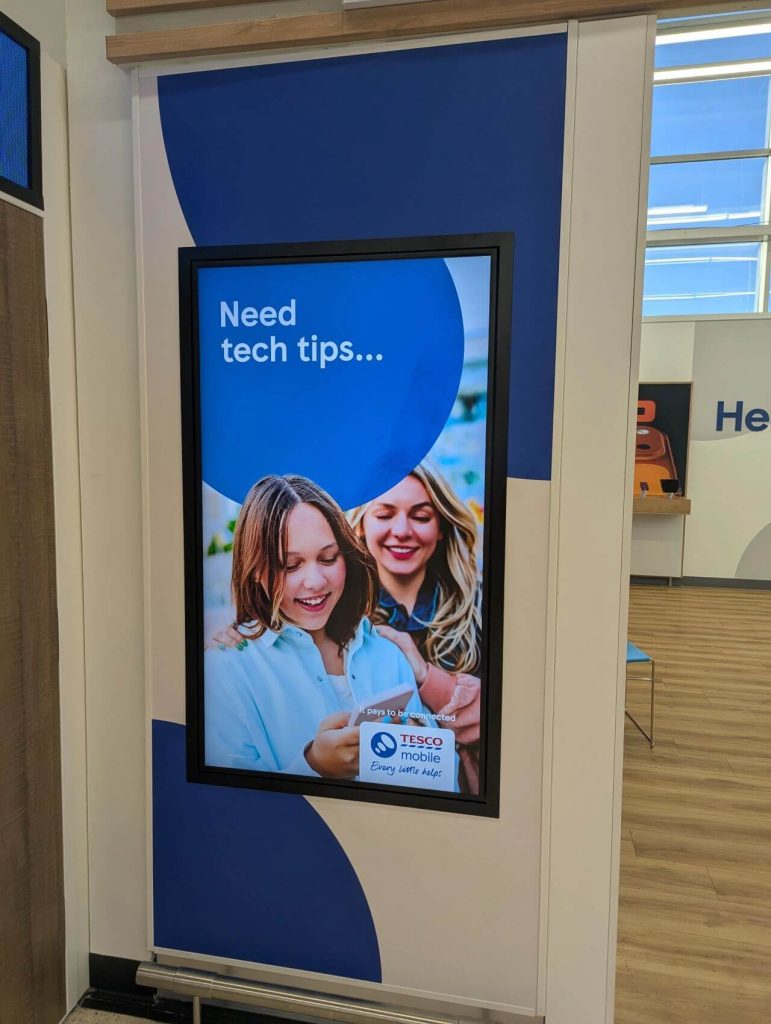 new digital screen installed at a Tesco Mobile Retail Store