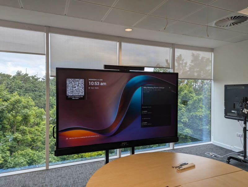the new screens mounted in the conference room